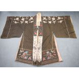 A LARGE 19TH CENTURY CHINESE SILKWORK EMBROIDERED ROBE decorated with foliage and vines. 120 cm high
