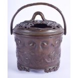 A 19TH CENTURY JAPANESE MEIJI PERIOD BRONZE CENSER AND COVER decorated with dragons and clouds. 13 c