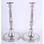 A PAIR OF 18TH/19TH CENTURY CONTINENTAL SILVER CANDLESTICKS decorated with acanthus. 560 grams. 26 c