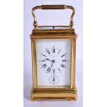 A CASED ANTIQUE REPEATING BRASS CARRIAGE CLOCK Camerer Kuss & Co London. 17 cm high inc handle.