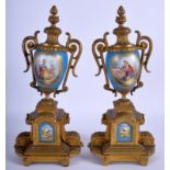 A PAIR OF LATE 19TH CENTURY FRENCH SEVRES PORCELAIN VASES painted with foliage. 30 cm high.