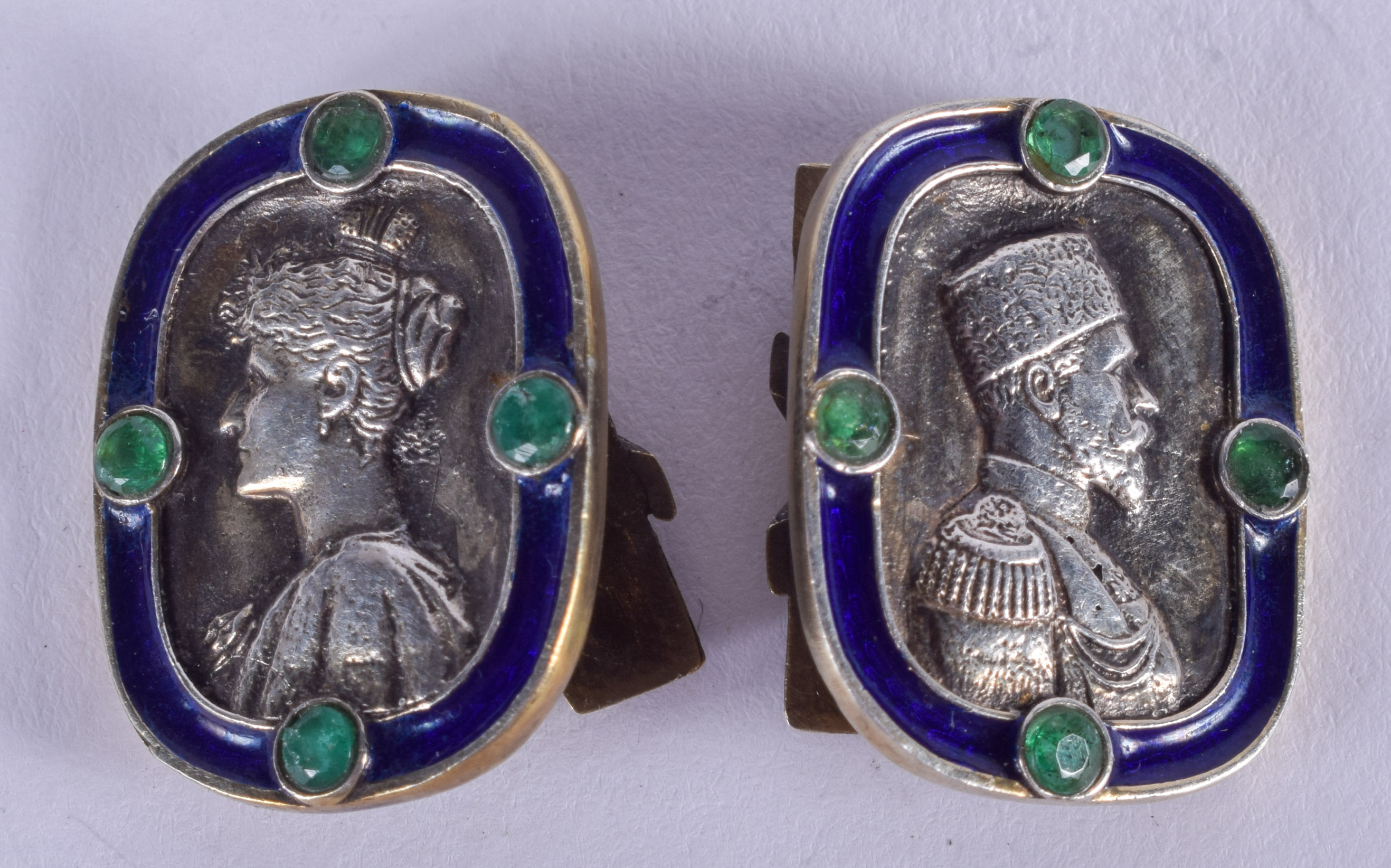 A PAIR OF CONTINENTAL SILVER AND ENAMEL PORTRAIT CUFFLINKS. 16 grams. 1.5 cm x 2.25 cm.