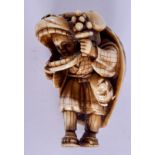 A 19TH CENTURY JAPANESE MEIJI PERIOD CARVED IVORY NETSUKE modelled as a boy wearing a carnival outfi
