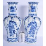 A LARGE PAIR OF 19TH CENTURY CHINESE BLUE AND WHITE VASES bearing Kangxi marks to base, painted with