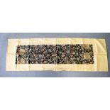 A 17TH/18TH CENTURY CHINESE BROCADE SILKWORK PANEL Ming/Qing, decorated with a black scrolling folia