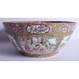 A LARGE 19TH CENTURY CHINESE CANTON FAMILLE ROSE PUNCH BOWL Qing, painted with figures and landscape