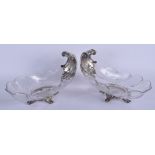 A LOVELY PAIR OF 19TH CENTURY FRENCH SILVER AND CRYSTAL GLASS SWEETMEAT DISHES of scrolling form. 21