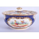 19th c. English porcelain sucrier and cover painted with exotic birds on a blue scale ground probabl