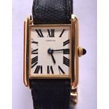 A BOXED COLLECTION PRIVEE CARTIER 18CT GOLD LADIES WRISTWATCH with papers. 2.25 cm x 2.75 cm.