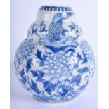 A 19TH CENTURY CHINESE BLUE AND WHITE TRIPLE RIBBED VASE bearing Kangxi marks to base. 18.5 cm high.