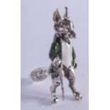 A SILVER AND ENAMEL FOX. 3 cm high.