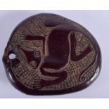 AN UNUSUAL 19TH CENTURY CONTINENTAL TRIBAL CARVED FLATTENED NUT depicting a lizard. 6 cm x 6.75 cm.