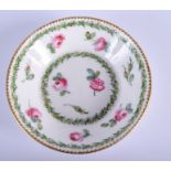 AN 18TH CENTURY SEVRES PORCELAIN SAUCER painted with roses. 12 cm wide.
