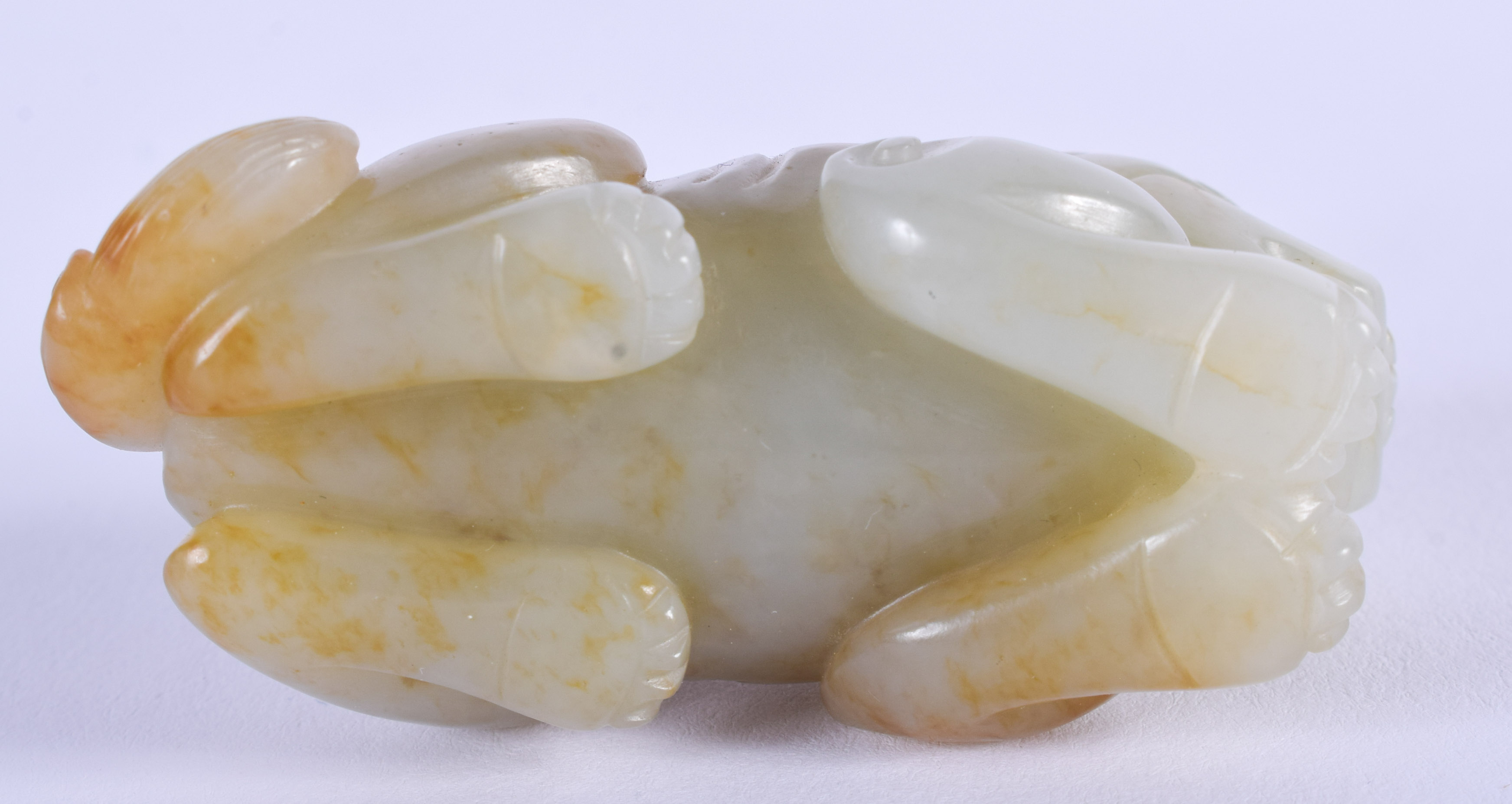 A 19TH CENTURY CHINESE CARVED GREENISH WHITE JADE BEAST Qing, with russet inclusions. 5.5 cm wide. - Image 3 of 9