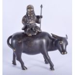 A 19TH CENTURY CHINESE BRONZE CENSER AND COVER modelled as a buddhistic deity upon a bullock. 18 cm