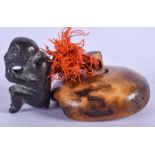 A 19TH CENTURY JAPANESE MEIJI PERIOD BRONZE AND BONE MANJU formed with an attached monkey. Manju 4.5