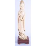 A 19TH CENTURY CHINESE CARVED IVORY FIGURE OF AN IMMORTAL modelled holding an upturned vase. Ivory 2