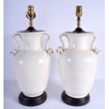 A LARGE PAIR OF EARLY 20TH CENTURY CHINESE TWIN HANDLED VASES converted to lamps. Pottery 33 cm high