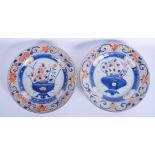 A LARGE PAIR OF EARLY 18TH CENTURY CHINESE EXPORT IMARI DISHES Kangxi/Yongzheng, painted with flower