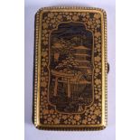 A 19TH CENTURY JAPANESE MIXED METAL KOMAI TYPE CASE decorated with landscapes. 8.5 cm x 5.5 cm.