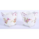 A PAIR OF 18TH CENTURY VIENNA PORCELAIN URNS of scalloped form, painted with flowers. 14 cm x 12 cm.