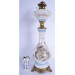 A VINTAGE OPALINE GLASS OIL LAMP decorated with buildings. 50 cm high.