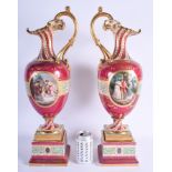 A VERY LARGE PAIR OF 19TH CENTURY VIENNA PORCELAIN PEDESTAL EWERS painted with classical figures wit