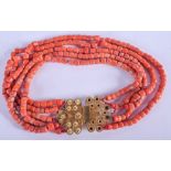 AN 18CT GOLD AND CORAL NECKLACE. 184 grams. 41 cm long, bead 0.5 cm x 0.5 cm.