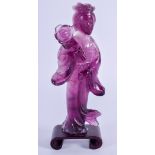 A LATE 19TH CENTURY CHINESE CARVED AMETHYST FIGURE OF GUANYIN modelled as a female holding a floral