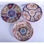 THREE LARGE 19TH CENTURY JAPANESE MEIJI PERIOD IMARI DISHES. 28 cm diameter. (3)