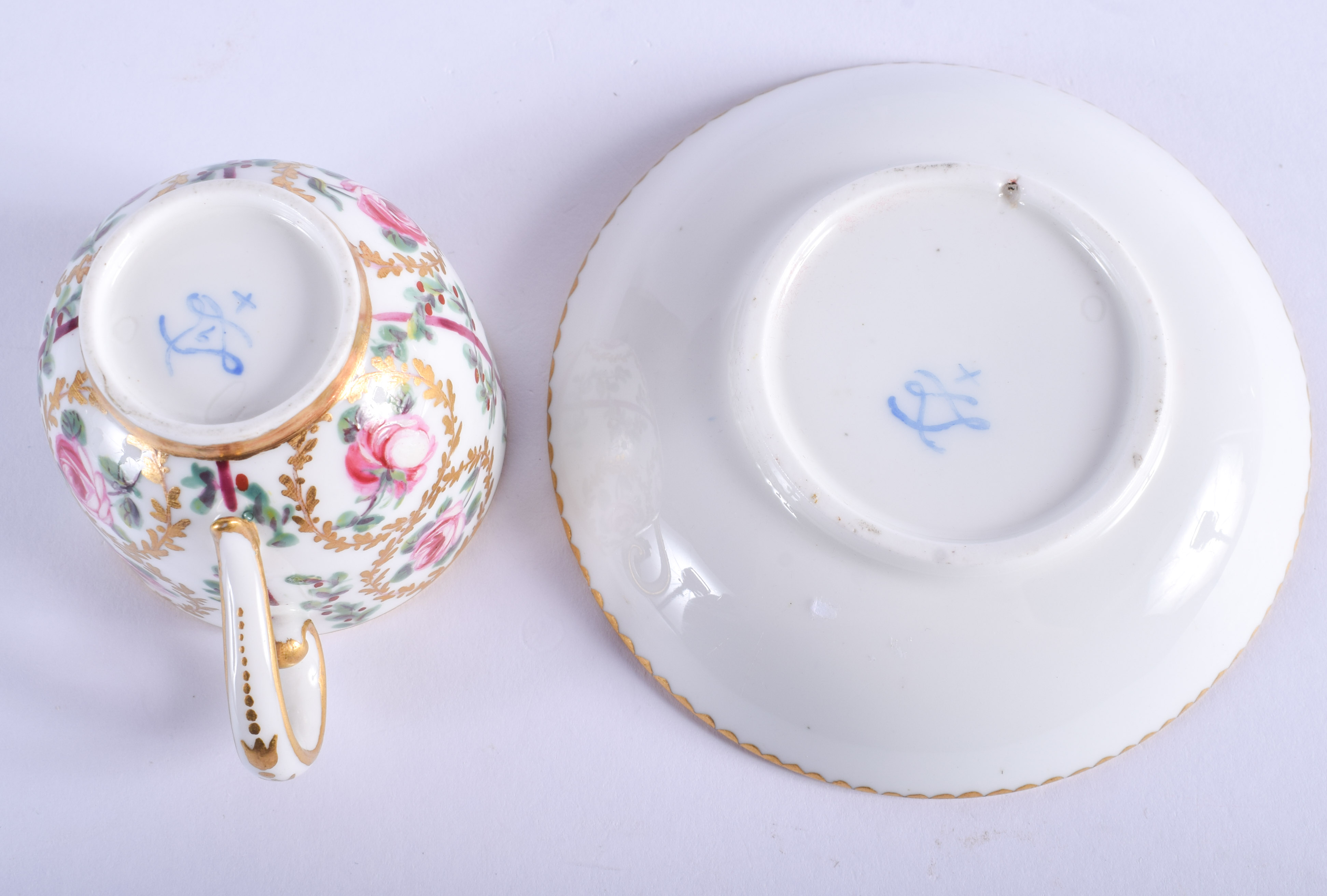 AN 18TH CENTURY SEVRES PORCELAIN CUP AND SAUCER painted with roses and gilt vines. (2) - Image 3 of 3