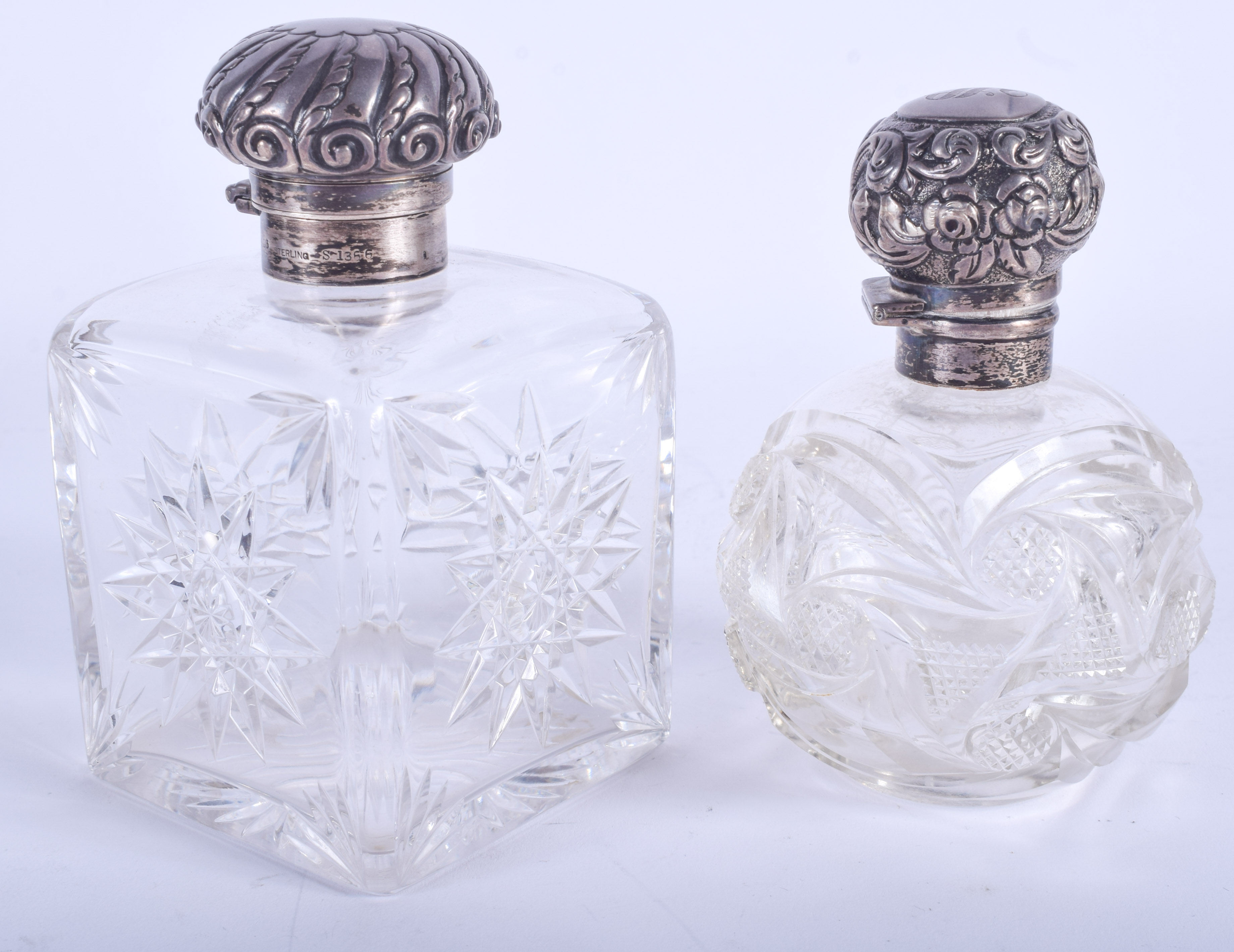 TWO ANTIQUE SILVER AND GLASS SCENT BOTTLES. 12 cm & 11 cm high. (2)