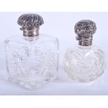 TWO ANTIQUE SILVER AND GLASS SCENT BOTTLES. 12 cm & 11 cm high. (2)