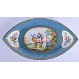 A LARGE 19TH CENTURY FRENCH SEVRES PORCELAIN OVAL DISH painted with figures on a donkey within a lan