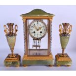 AN EARLY 20TH CENTURY FRENCH CHAMPLEVE ENAMEL AND ONYX CLOCK GARNITURE decorated with foliage. 34 cm