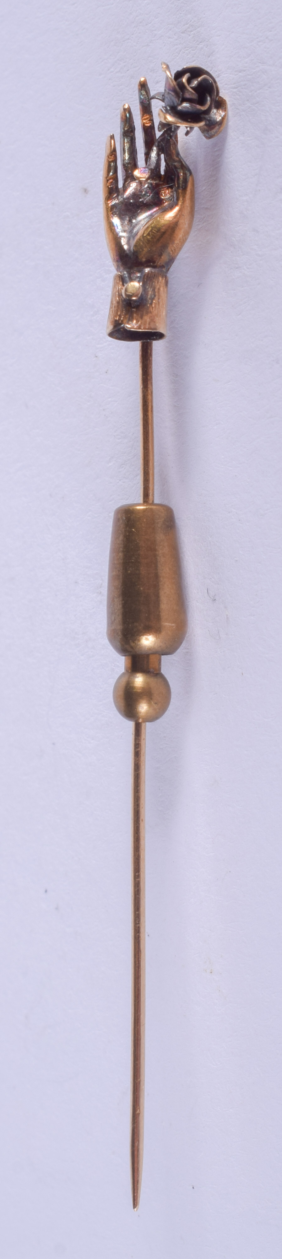 A VICTORIAN 15CT GOLD HAND NOVELTY STICK PIN. 3.6 grams overall.