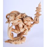 A 19TH CENTURY JAPANESE MEIJI PERIOD CARVED IVORY OKIMONO modelled as oni holding aloft a temple. 8