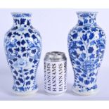 A PAIR OF 19TH CENTURY CHINESE BLUE AND WHITE VASES bearing Kangxi marks to base, painted with drago