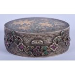A 19TH CENTURY INDIAN SILVER ENAMEL RUBY AND EMERALD PILL BOX decorated with hunting scenes. 5 cm wi