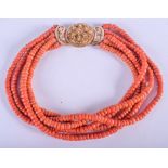 AN 18CT GOLD AND CORAL NECKLACE. 184 grams. 191 cm long, bead 0.5 cm x 0.5 cm.