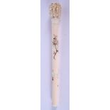 A 19TH CENTURY JAPANESE MEIJI PERIOD CARVED SHIBAYAMA IVORY PARASOL HANDLE formed with numerous mask