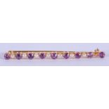 AN ANTIQUE GOLD AMETHYST AND PEARL BROOCH. 3.9 grams. 5.5 cm high.