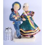 A LARGE FRENCH HENRIOT QUIMPER POTTERY FIGURE modelled as a young boy and girl. 36 cm