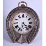 A RARE VICTORIAN SILVER TRAVELLING HORSE SHOE STRUT DESK CLOCK with large enamelled dial. 9.5 cm x 1