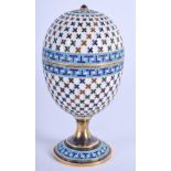 AN ANTIQUE RUSSIAN SILVER AND ENAMEL EGG CUP AND COVER decorated with star motifs. 86 grams. 8.5 cm