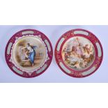 A PAIR OF EARLY 20TH CENTURY VIENNA PORCELAIN CABINET PLATES painted with classical scenes. 24 cm di