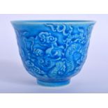 A CHINESE BLUE GLAZED DRAGON TEABOWL. 6.5 cm wide.