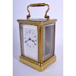 A VINTAGE FRENCH BRASS CARRIAGE CLOCK. 16 cm high inc handle.