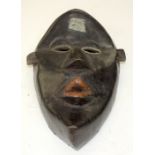 A TRIBAL DAN MASK. Ivory Coast. 19cm x 12cm x 28cm