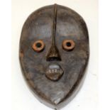 A TRIBAL DAN BUGLE MASK. Ivory Coast. 17cm x 9cm x 54cm